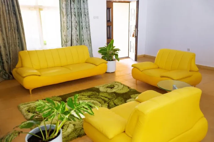 Beautiful display of yellow couches in the presidential apartment of Carter Conlon Center