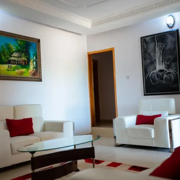 Sitting area of Carter conlon resort in Jos featuring white counches and center table