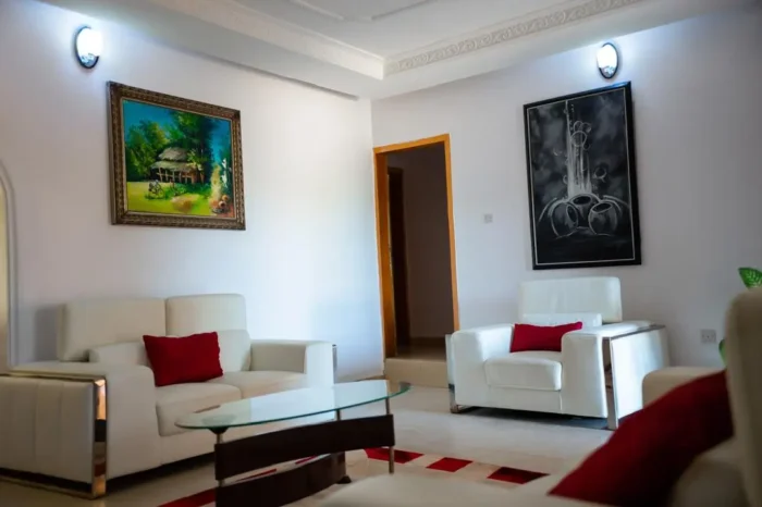 Sitting area of Carter conlon resort in Jos featuring white counches and center table