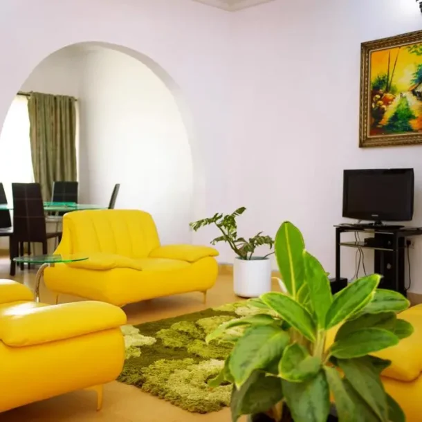 Sitting area of Carter Conlon Center and Resort featuring yellow couch in Jos Plateau state