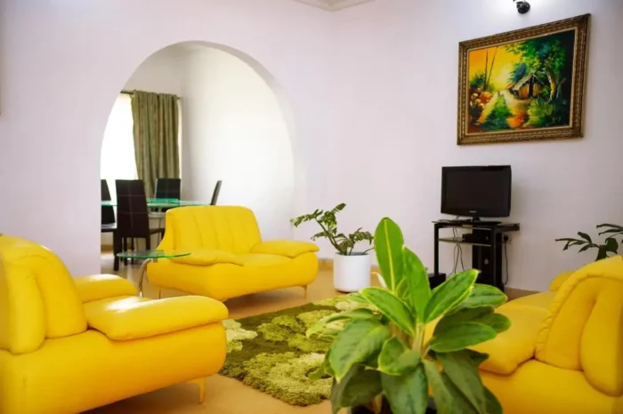 Sitting area of Carter Conlon Center and Resort featuring yellow couch in Jos Plateau state