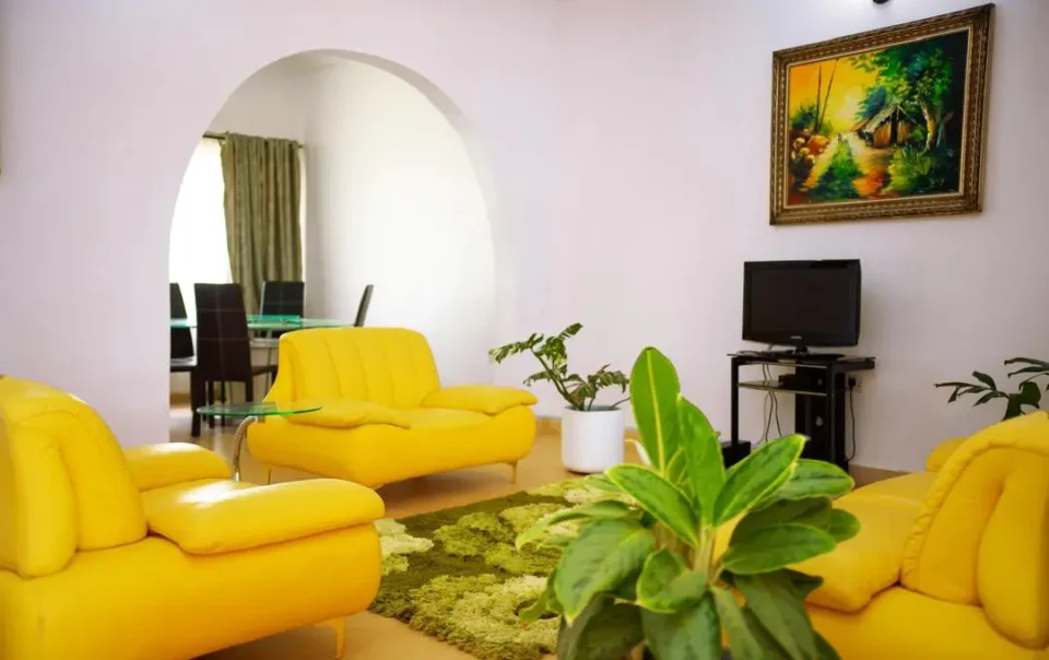 Sitting area of Carter Conlon Center and Resort featuring yellow couch in Jos Plateau state